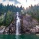 Kayakers approaching a waterfall in Toba Inlet